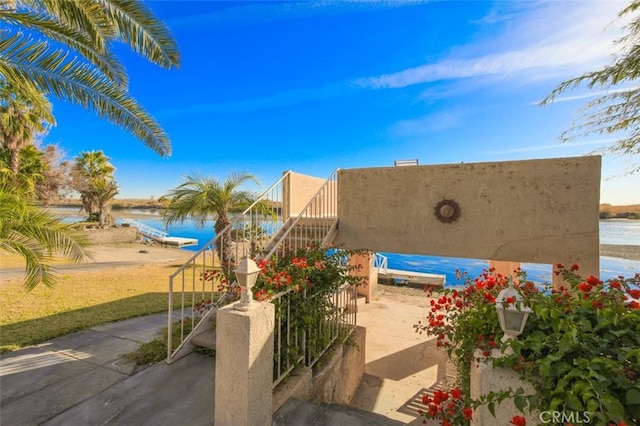 view of patio with a water view