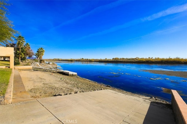 dock area with a water view