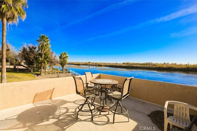 view of patio / terrace with a water view