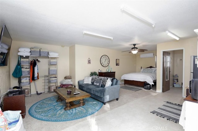 bedroom featuring a wall unit AC and ceiling fan