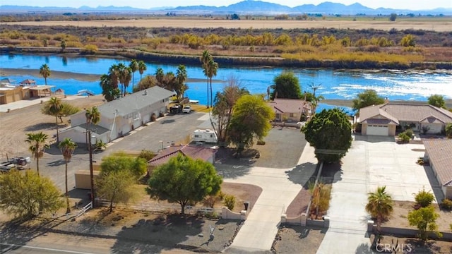 bird's eye view featuring a water and mountain view