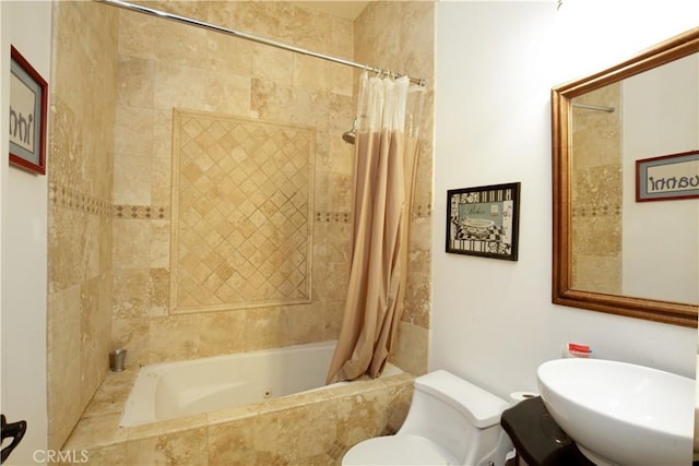 full bathroom with sink, toilet, and shower / bathtub combination with curtain