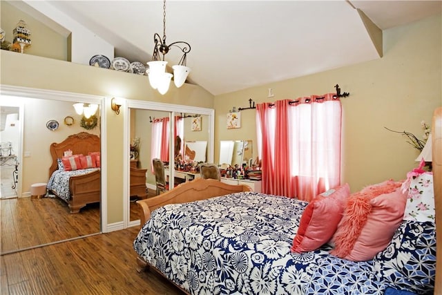 bedroom with lofted ceiling, a closet, and dark hardwood / wood-style floors