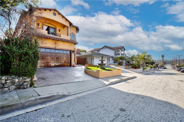 mediterranean / spanish-style house featuring a garage