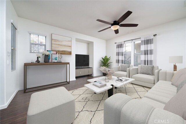 living room featuring ceiling fan, a healthy amount of sunlight, and hardwood / wood-style flooring