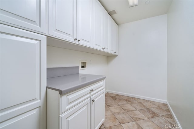 laundry area with cabinets and hookup for a washing machine