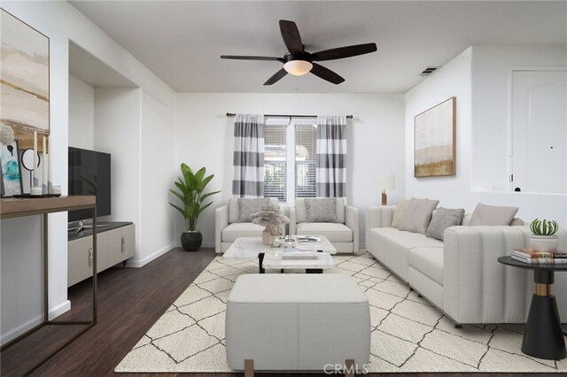 living room with ceiling fan and hardwood / wood-style floors