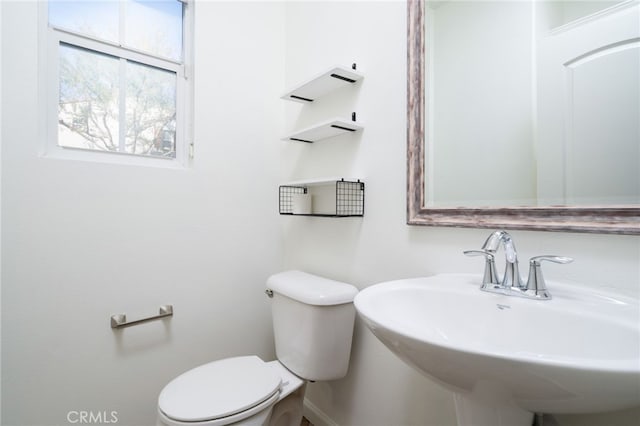 bathroom featuring sink and toilet