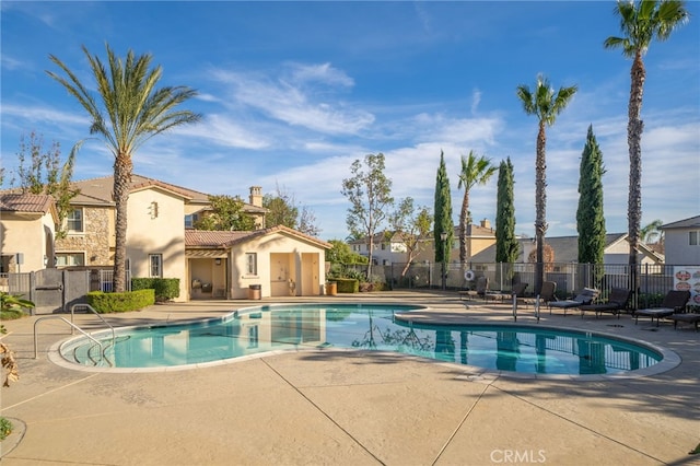 view of swimming pool with a patio