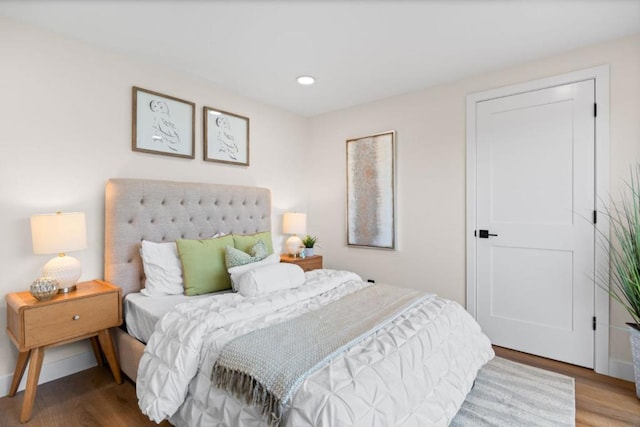 bedroom with wood-type flooring