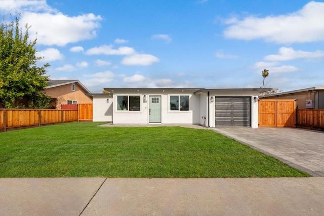 ranch-style house featuring a front yard and a garage