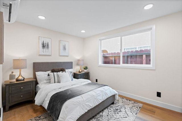 bedroom with hardwood / wood-style floors