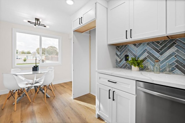 kitchen with dishwasher, white cabinetry, tasteful backsplash, light hardwood / wood-style floors, and light stone counters