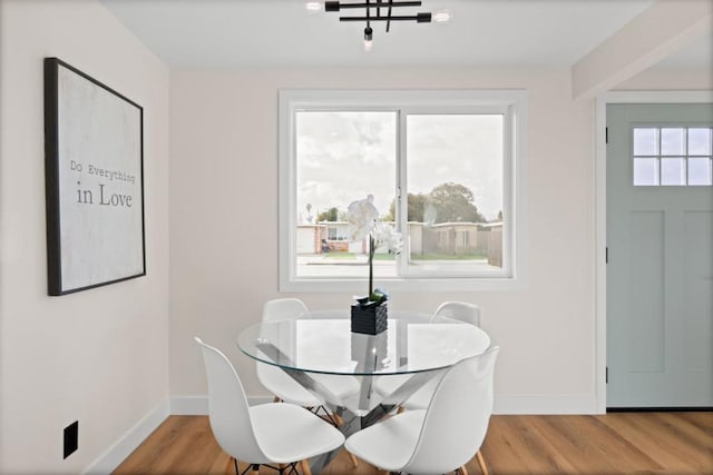 dining area featuring a chandelier and hardwood / wood-style flooring