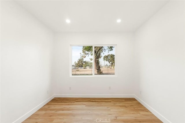 empty room with light hardwood / wood-style floors