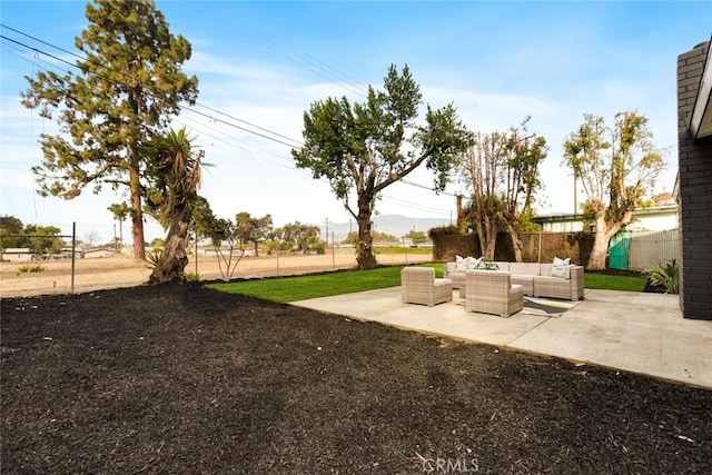 view of yard with outdoor lounge area and a patio