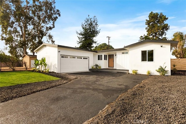 ranch-style house with a front lawn and a garage