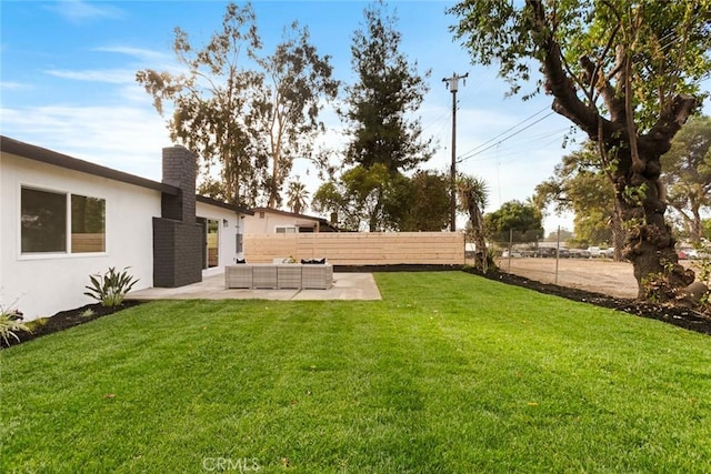 view of yard with a patio area and outdoor lounge area