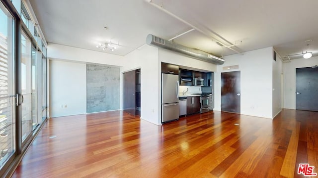 unfurnished living room featuring wood-type flooring