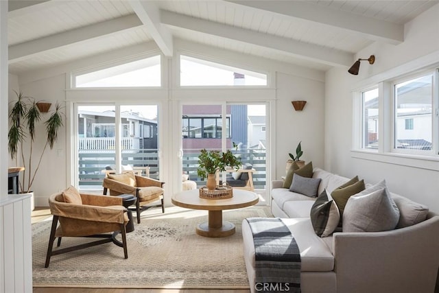 living room featuring lofted ceiling with beams