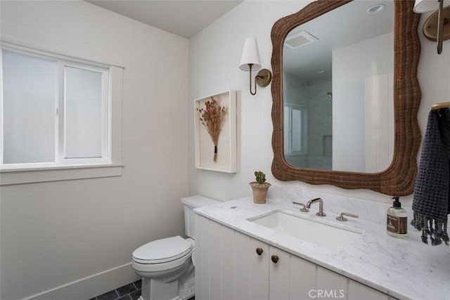 bathroom featuring toilet, tile patterned flooring, a healthy amount of sunlight, and vanity