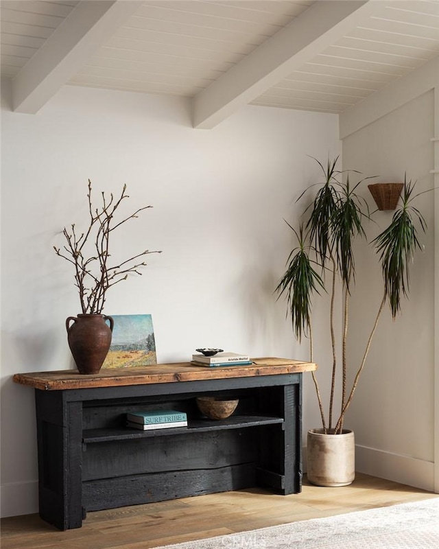 room details featuring wood-type flooring and beamed ceiling