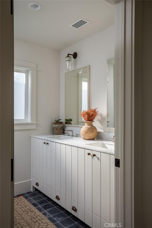 bathroom with vanity and tile patterned floors