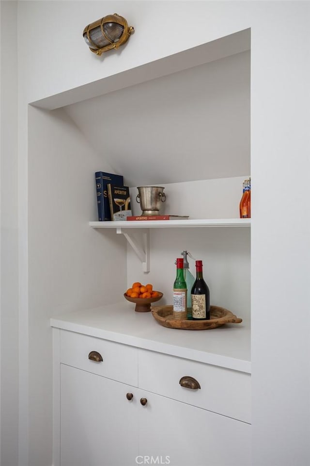 bar with white cabinetry