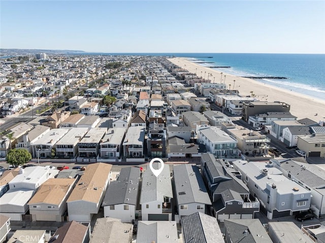 birds eye view of property featuring a view of the beach and a water view