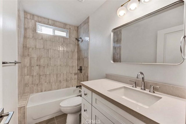 full bathroom with tiled shower / bath, vanity, toilet, and tile patterned flooring