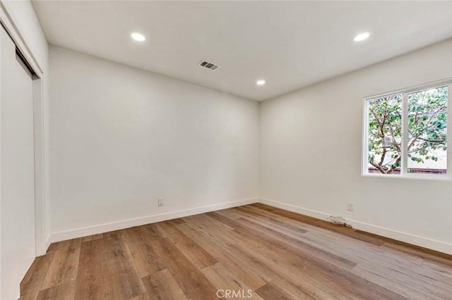 unfurnished room featuring light wood-type flooring