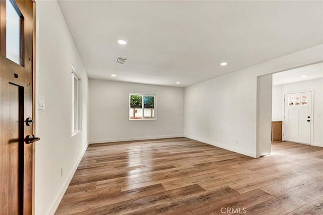 unfurnished room with light hardwood / wood-style flooring