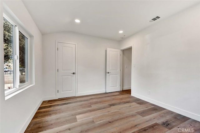 spare room featuring light hardwood / wood-style flooring