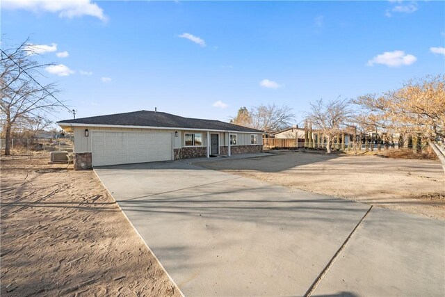 ranch-style home featuring a garage