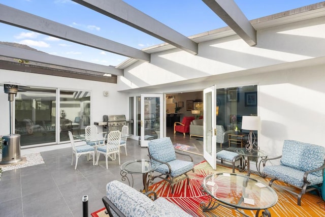 view of patio featuring an outdoor living space, a pergola, and a grill