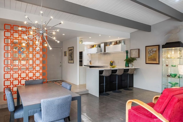 dining room with a chandelier and beam ceiling