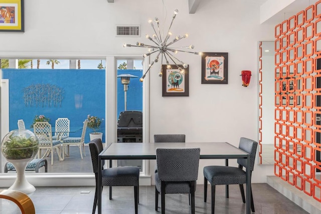 dining area featuring an inviting chandelier