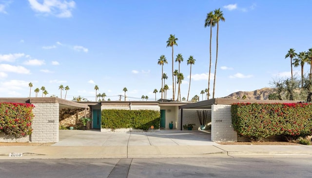 view of front of property featuring a carport