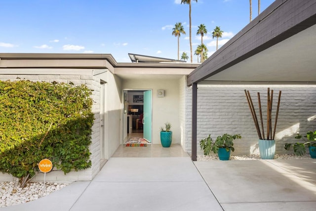 doorway to property featuring a patio