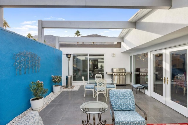 view of patio featuring grilling area and french doors