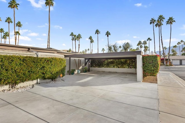 view of property's community with a carport