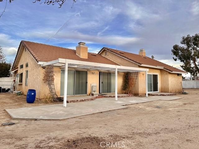 rear view of house with a patio area