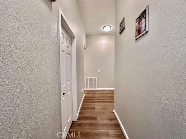 hall featuring dark wood-type flooring