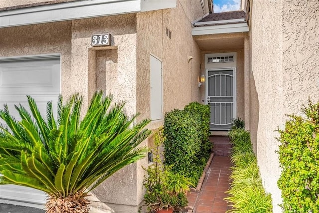 doorway to property featuring a garage