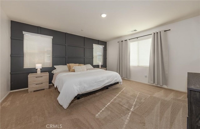 bedroom featuring light colored carpet