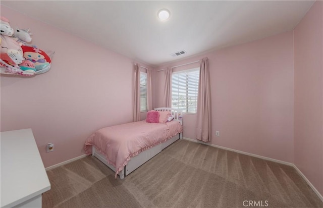 bedroom with light colored carpet