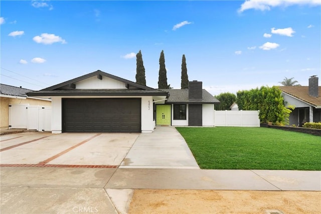 ranch-style house with a garage and a front yard