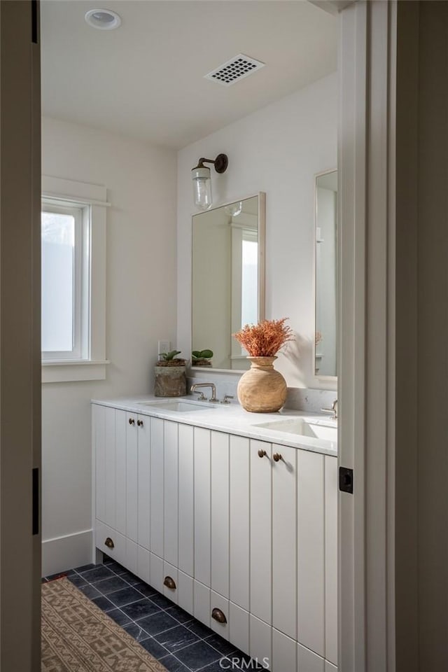 bathroom featuring tile patterned floors and vanity