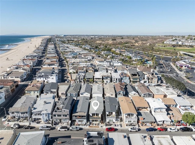 bird's eye view with a view of the beach and a water view