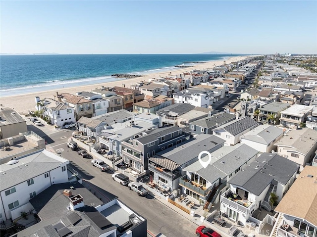 bird's eye view featuring a water view and a view of the beach